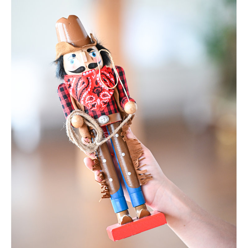 The Holiday Aisle® Western Wooden Nutcracker with a Rope and Lasso